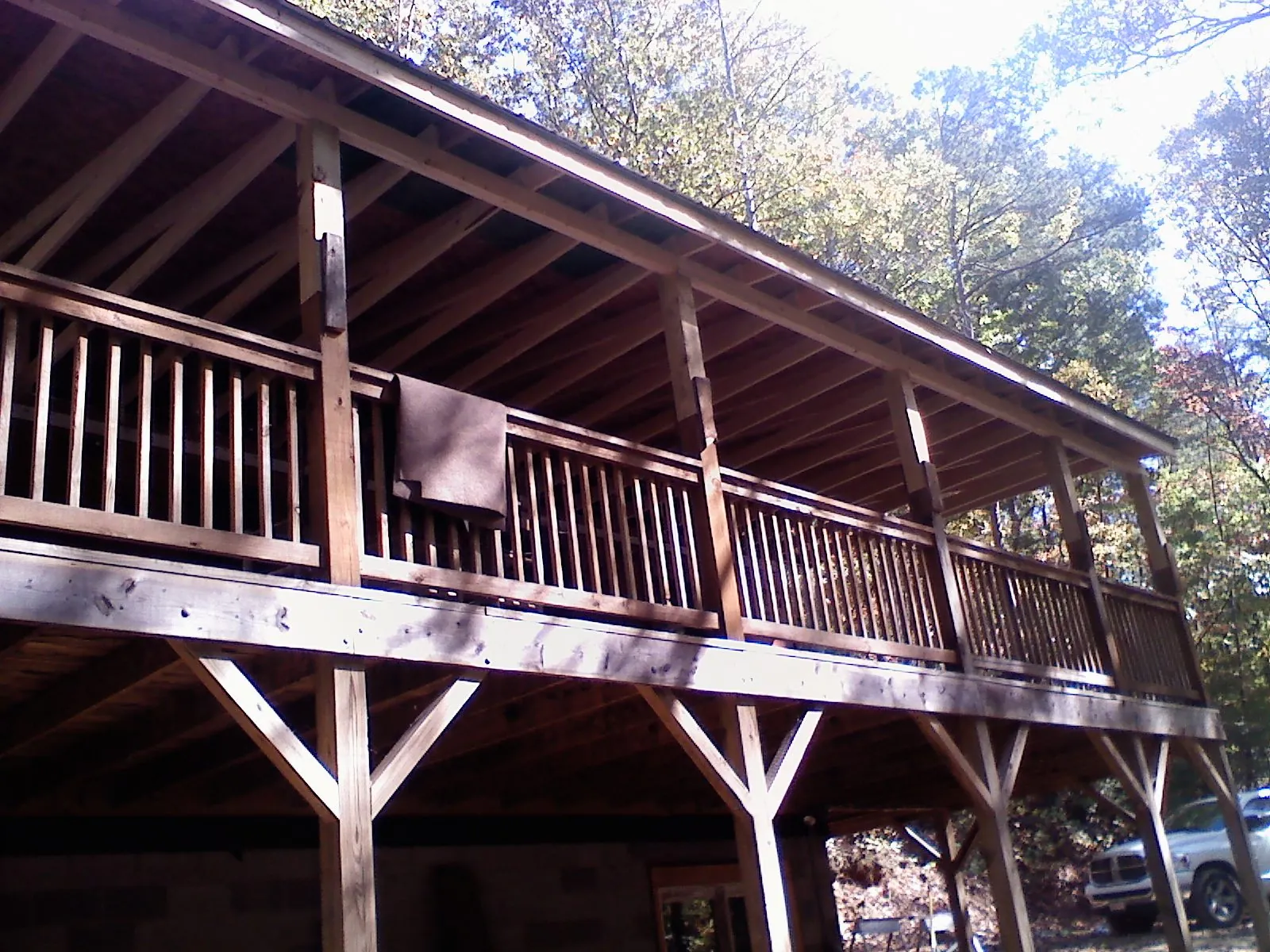 Timber framing under a new elevated porch and deck — Roof Leak Repair in Baldwinsville by Roofing Brothers